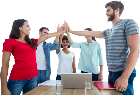 Happy business team putting their hands together