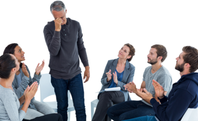 Rehab group applauding delighted man standing up