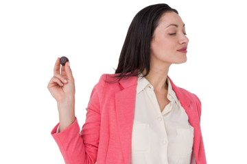 Pretty brunette holding piece of chocolate