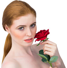 Fototapeta premium Beautiful redhead posing with red rose