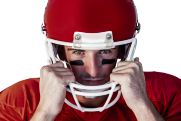 Portrait of rugby player wit hands on helmet