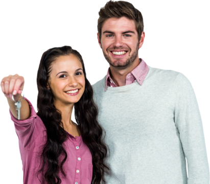 Portrait of happy couple holding keys 