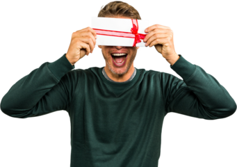 Cheerful man hiding face with gift