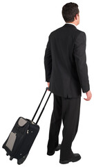 Businessman pulling his suitcase