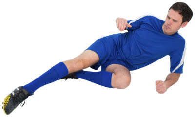 Football player in blue kicking
