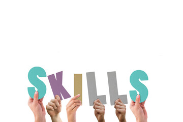 Cropped hands holding colorful alphabets forming skills
