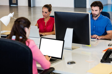 Colleagues working in conference room