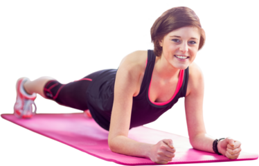 Portrait of happy woman doing plank on exercise mat