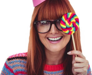 Smiling hipster woman with lollipop and hat party