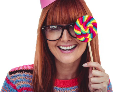 Smiling hipster woman with lollipop and hat party
