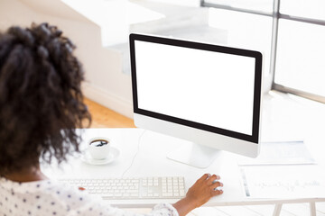 over the shoulder view of woman using computer