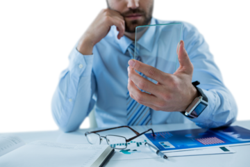 Midsection of businessman holding glass sheet