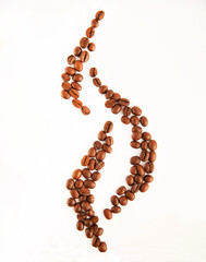 Roasted coffee beans on a white background, close-up. The concept of steaming hot coffee.