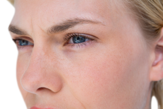 Serious blond woman looking away