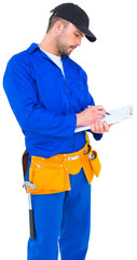 Handyman in blue overall writing on clipboard