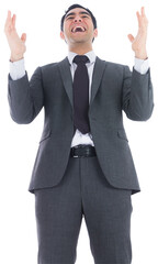 Excited businessman with arms raised