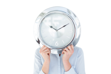 Businesswoman in suit holding a clock