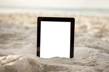 Digital tablet kept on sand
