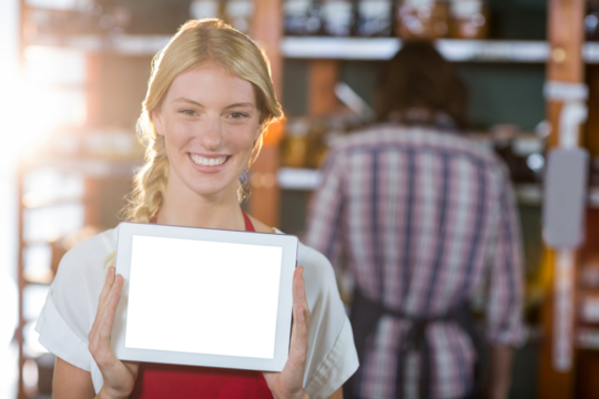 Female staff showing digital tablet in supermarket - Powered by Adobe