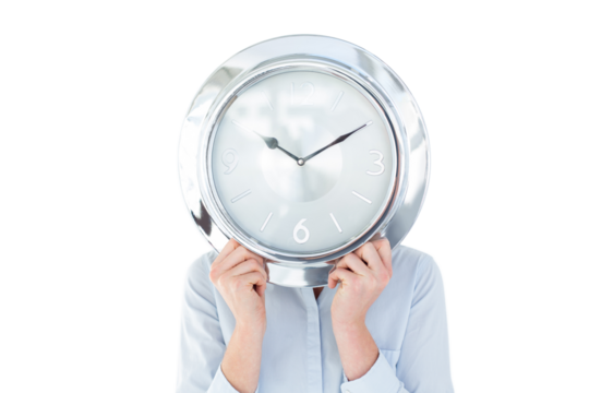 Businesswoman in suit holding a clock - Powered by Adobe