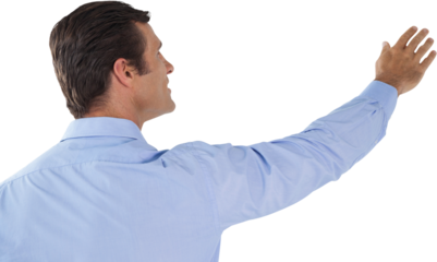 Businessman with arms raised touching invisible interface