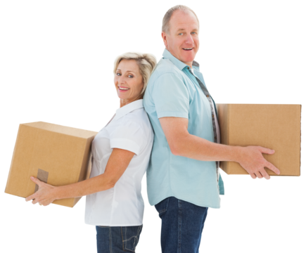 Happy older couple holding moving boxes
