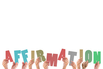 Cropped hands holding colorful word affirmation 