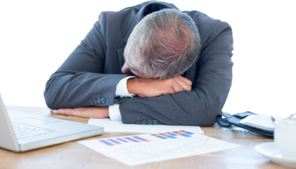 Tired businessman resting on desk