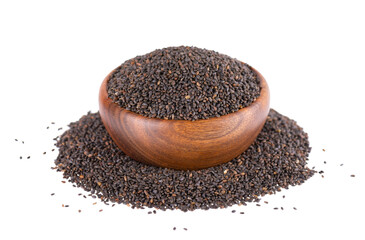 Basil seeds in wooden bowl, isolated on white background. Ocimum basilicum.