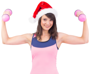 Woman in santa hat holding hand weight