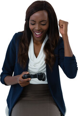 Happy businesswoman playing video game