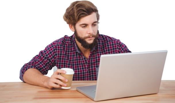 Serious hipster holding disposable cup working on laptop - Powered by Adobe