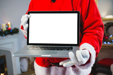 Santa claus holding a laptop