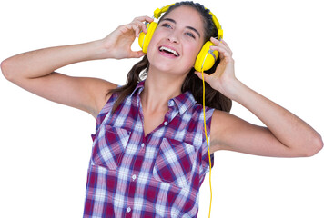 Beautiful woman enjoying music through headphones