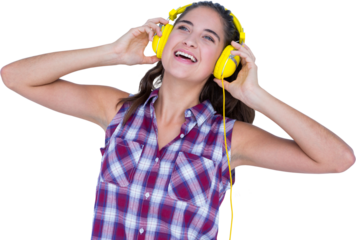 Beautiful woman enjoying music through headphones