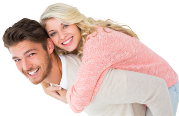 Handsome man giving piggy back to his girlfriend