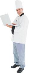 Chef standing holding a laptop