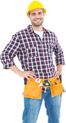 Handyman wearing tool belt while standing hands on hips