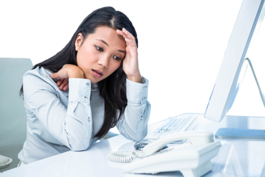 Unsmiling businesswoman with hands on face