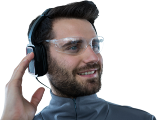 Happy man listening music through headphones