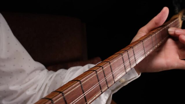 man playing turkish saz