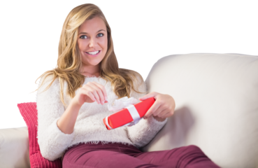 Pretty blonde opening a gift
