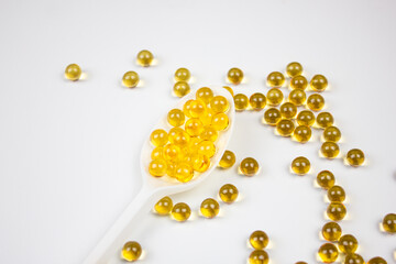 Fish oil capsules on a white background. Natural fish oil. Fish oil capsules.
