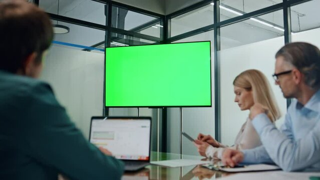 Business partners working green screen tv. Closeup people listening conference