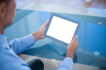 Businessman using his tablet 