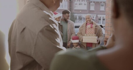 Family arriving at Grandparents to celebrate Christmas together