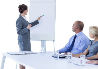 Business people looking at meeting board during conference