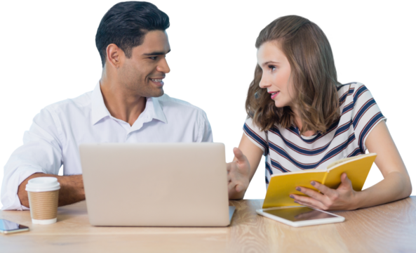 Business people discussing while sitting at table