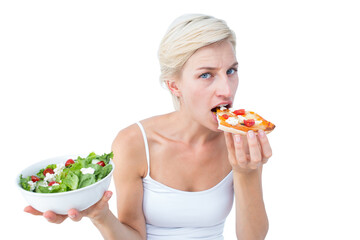 Pretty woman deciding eating pizza rather the salad