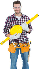 Handyman holding hard hat and spirit level